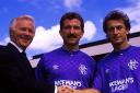 Trevor Francis (right) is welcomed by Ibrox by chairman David Holmes and player/manager Graeme Souness