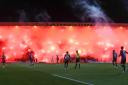 Rangers fans set off a sea of pyro at Dens Park