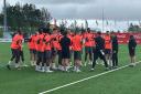 Stephen Robinson briefs his players in Reykjavik