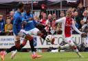 Connor Goldson and Dujon Sterling battle with Ajax's Kenneth Taylor