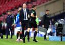 Referee Matthew MacDermid goes to the pitchside VAR monitor before awarding Rangers' their first goal of the game