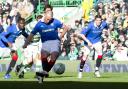 Rangers’ Kenny Miller scores against Celtic from 12-yards