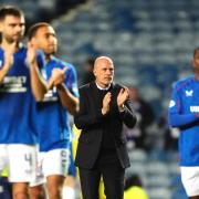 The manager and players clap the fans