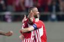 Olympiacos' Ayoub El Kaabi celebrates scoring their side's second goal of the game during the UEFA Europa Conference League semi-final against Aston Villa.