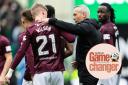 Hearts manager Neil Critchley, right, congratulates teenage striker James Wilson on his goal against Hibernian at Easter Road last month