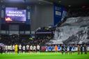 GLASGOW, SCOTLAND - NOVEMBER 10: The teams observe a minutes silence ahead of kick off for Remembrance Sunday during a William Hill Scottish Premiership match between Rangers and Heart of Midlothian at Ibrox Stadium, on November 10, 2024, in Glasgow,