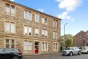 The tenement flat is located in the Anniesland area of Glasgow