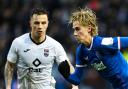 Todd Cantwell and Eamonn Brophy compete in a match between Rangers and Ross County