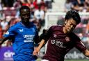 Mohamed Diomande and Yutaro Oda compete for the ball at Tynecastle