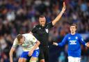 Rangers' Jefte (not pictured) is shown a red card following a second yellow