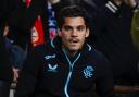 Rangers' Ianis Hagi watches on from the stands during a UEFA Champions League play-off round first leg match