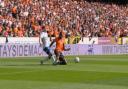 Emmanuel Adegboyega tackles Connor Barron