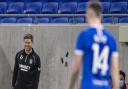 Steven Gerrard smiles at Ryan Kent from the Rangers dugout during the 2020/21 season