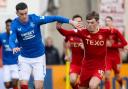 Tom Lawrence and Leighton Clarkson battle for the ball