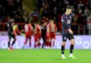 Rangers' Tom Lawrence (right) looks frustrated as Aberdeen's Shayden Morris (hidden) celebrates scoring their side's second goal of the game with team-mates during the William Hill Premiership match at Pittodrie Stadium, Aberdeen. Picture date: Wednesday