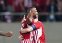 Olympiacos' Ayoub El Kaabi celebrates scoring their side's second goal of the game during the UEFA Europa Conference League semi-final against Aston Villa.