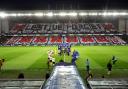 The teams walk out the tunnel at Ibrox