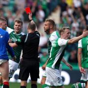 Referee Willie Collum shows John Lundstram of Rangers, left, a red card at Easter Road on Saturday