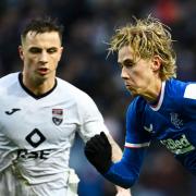 Todd Cantwell and Eamonn Brophy compete in a match between Rangers and Ross County