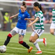 Rangers player Rachel Rowe shields the ball from Mengyu Shen of Celtic at Broadwood today