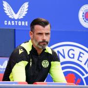 Motherwell manager Stuart Kettlewell sits in the away dugout at Hampden Park