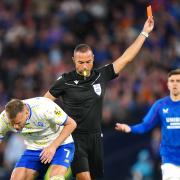 Rangers' Jefte (not pictured) is shown a red card following a second yellow