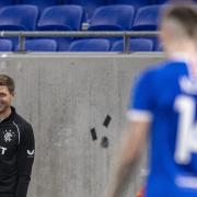 Steven Gerrard smiles at Ryan Kent from the Rangers dugout during the 2020/21 season