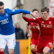 Tom Lawrence and Leighton Clarkson battle for the ball