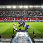 The teams walk out the tunnel at Ibrox