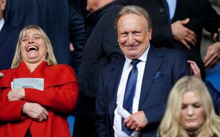 Neil Warnock posed for photos with supporters before taking his seat at Ibrox