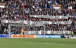 Rangers fans with protest banners during the William Hill Premiership match at The BBSP Stadium Rugby Park