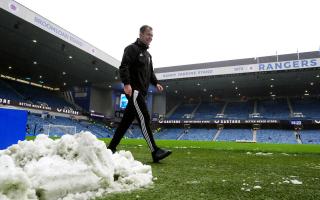 Referee Don Robertson after checking the pitch and VAR setup at Ibrox